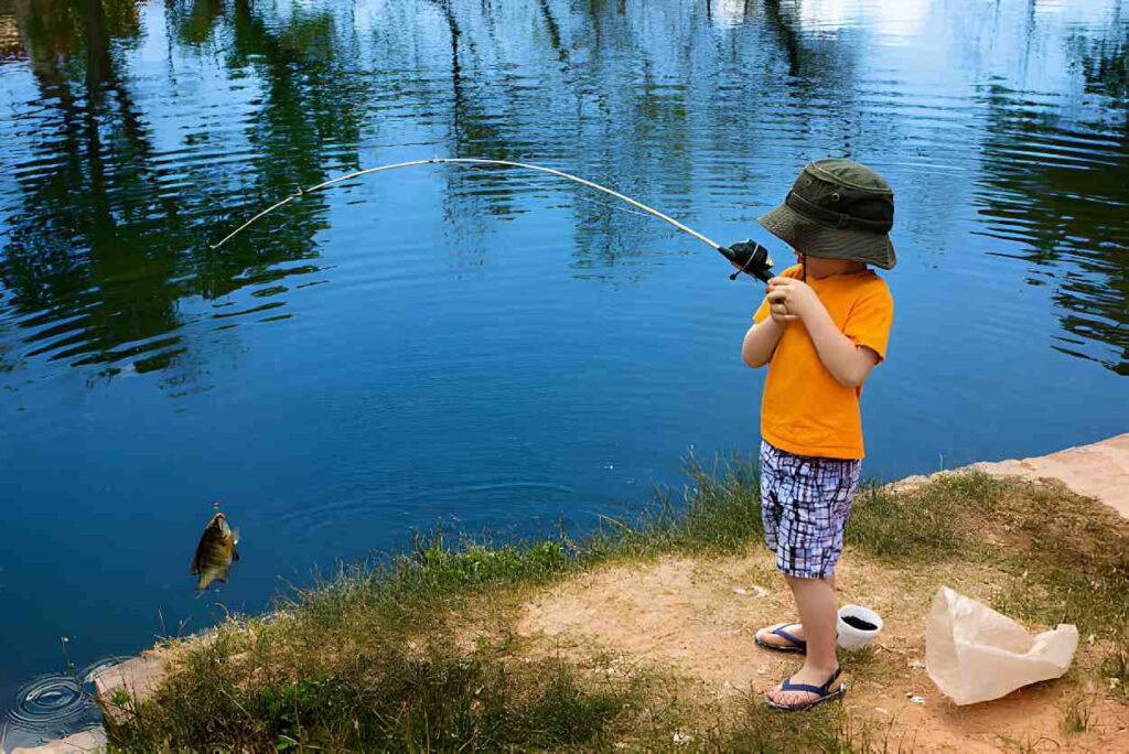 A child fishing in blue pool