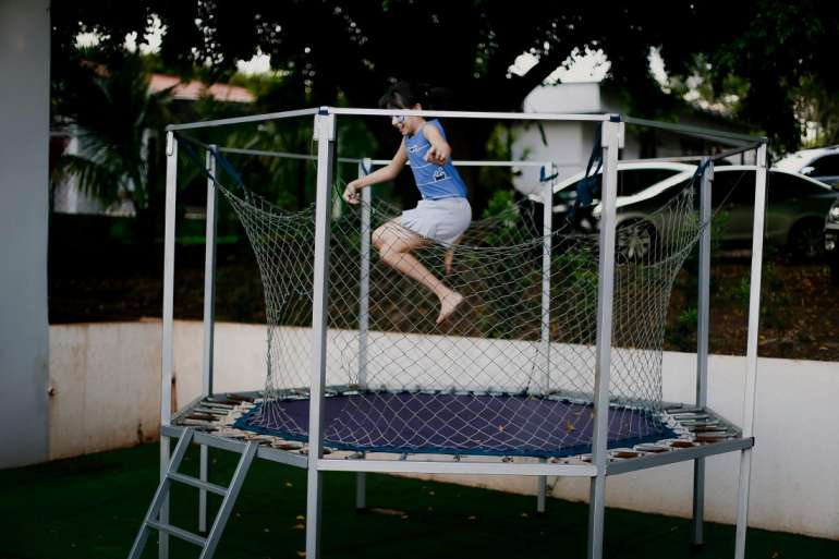 Person jumping high on a trampoline